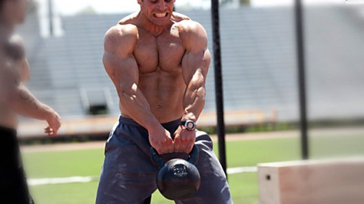 A Man Doing Kettlebell Swing