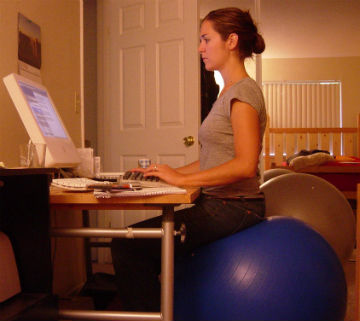 Girl Sitting on Fitness Ball