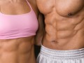 A fir couple showing strong abs. A couple with six pack.