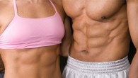 A fir couple showing strong abs. A couple with six pack.