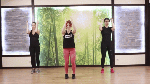 Three fit Girls are doing Standing Chest Flies exercise