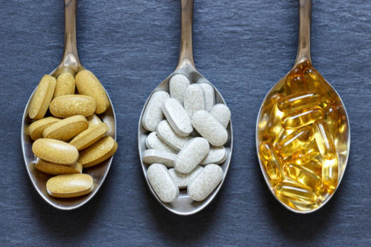 Three spoons on blue with Popular Types of Dietary Health Supplements