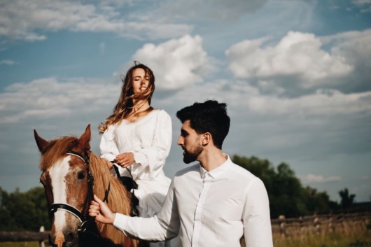 Man and woman are taking a horse ride as their first date