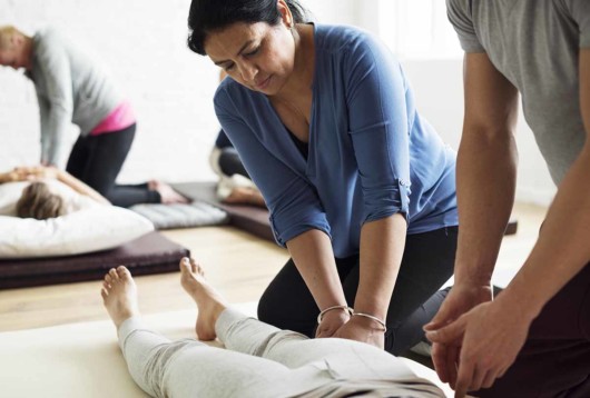 People are at the massage school practicing to get the certificate