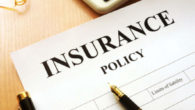 Insurance policy paper on wooden table