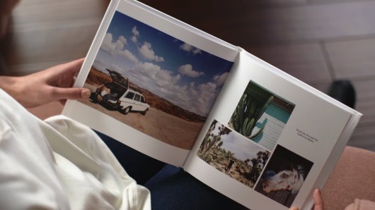 A girl checking her photo book that she made to preserve her memory 