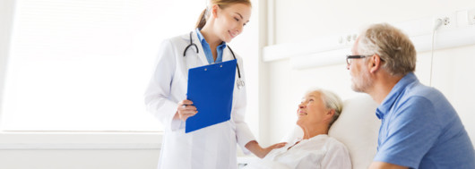 The doctor is checking the patient lady in the hospital