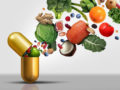 Vitamins supplements as a capsule with fruit vegetables nuts and beans inside