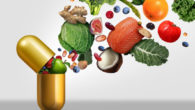 Vitamins supplements as a capsule with fruit vegetables nuts and beans inside