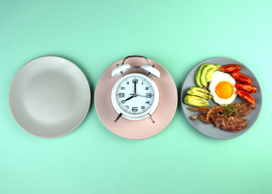 Intermittent fasting concept with empty colorful plates.