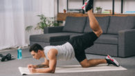 Guy is exercising at home to build muscles