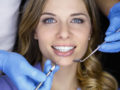 Dentist examining a patient teeth in the dentist.