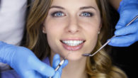 Dentist examining a patient teeth in the dentist.