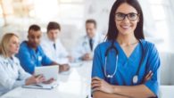 A girl in the doctor's outfit and stethoscope looks into the camera and smile