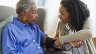 A girl is checking the blood pressure