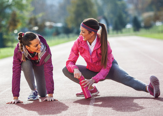 Girls are exercising and having fun outside 