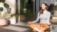 Girl is sitting outside in the sun and meditate