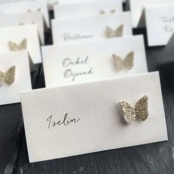 White invitations to a religious event on the wooden background