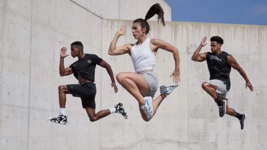 Three athletes jumped in the air