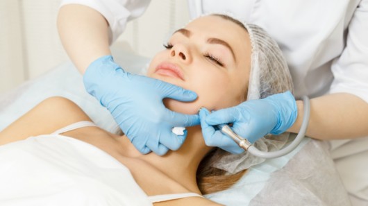 A doctor doing peptide procedure to a girl