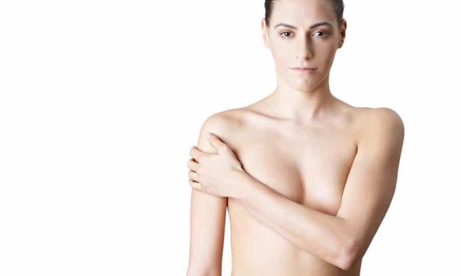 Girl covering her breasts after bilateral mastectomy