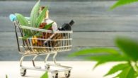Cbd products in the cart on the wooden background