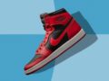 A close up image of red and black Air Jordan 1 sneakers on blue background