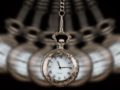 A swinging gold watch used for Quantum Healing Hypnosis on black background