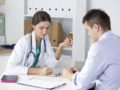 A doctor is prescribing medication to the patient