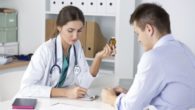 A doctor is prescribing medication to the patient