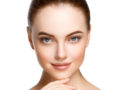 A close up face of a beautiful girl on white. Ideal face of a girl after cosmetic procedures