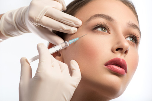 Young girl getting Botox treatment