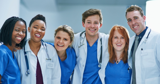 A group of healthcare professionals are smiling