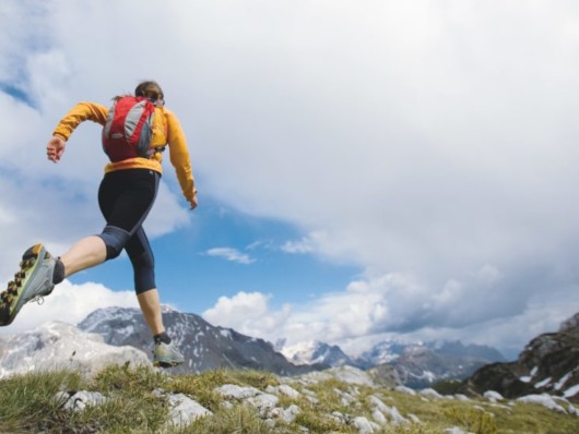 Girl is running in the mountains