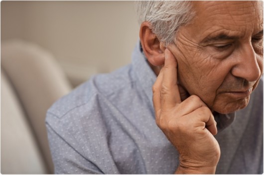 An old man with a hearing loss