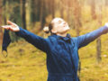 A girl in the forest is showing how happy and healthy she is