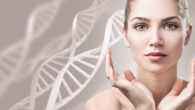 A close up face of a beautiful and young girl on white with DNA at the back ground