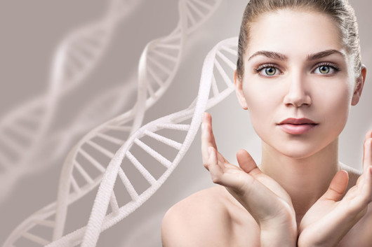 A close up face of a beautiful and young girl on white with DNA at the back ground