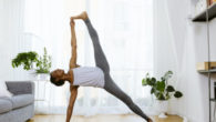 Woman practicing yoga at home