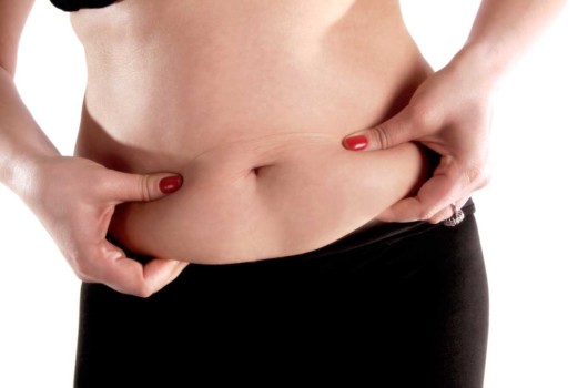 A close up picture of a woman on white background with a big belly