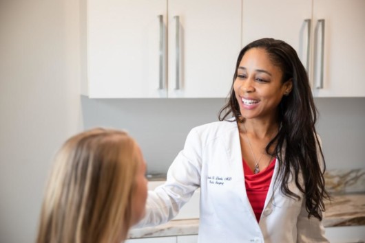 A woman is consulting with a plastic surgeon