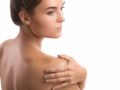 A girl on white background with a big scar on her shoulder